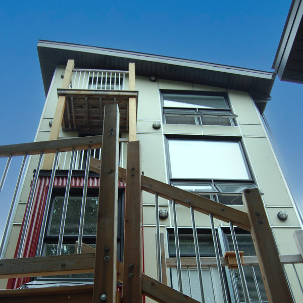 Exterior view of the Pushman Residence, windows and stairs.