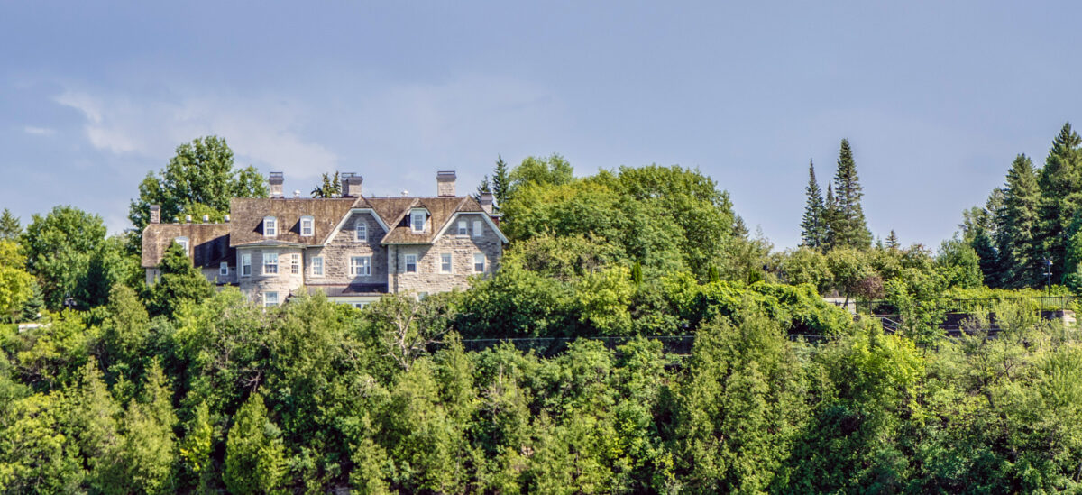 A view of 24 Sussex Drive and surrounding greenery